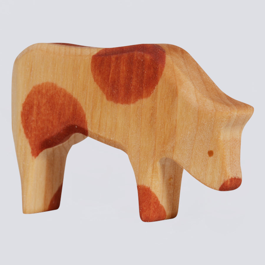 Holzfigur Kuh grasend
